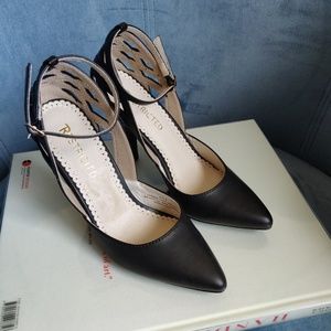Restricted Black Cut-Out Pumps